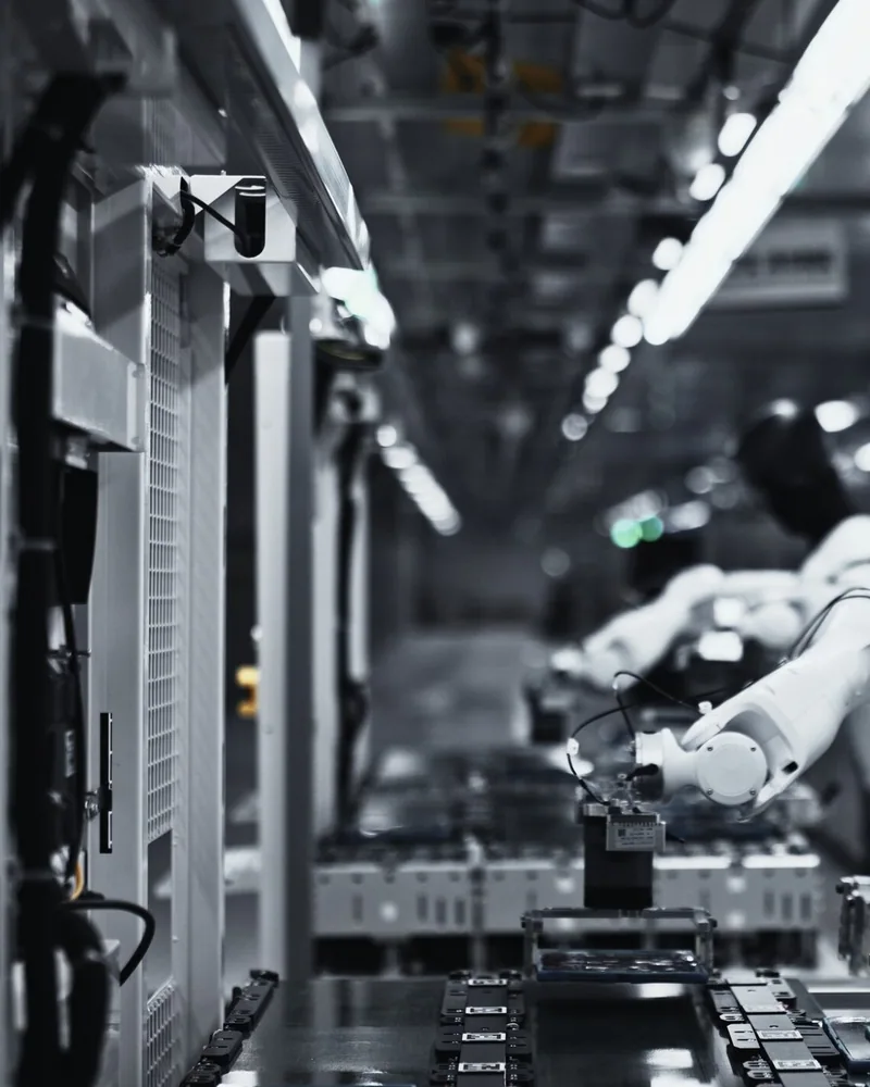 Robots loading tablets on a live line